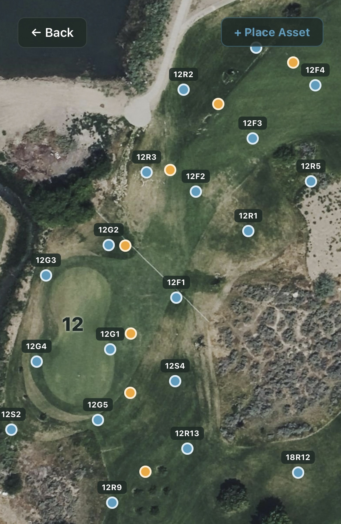 Mobile app showing a golf hole with labeled irrigation assets, viewed in the field